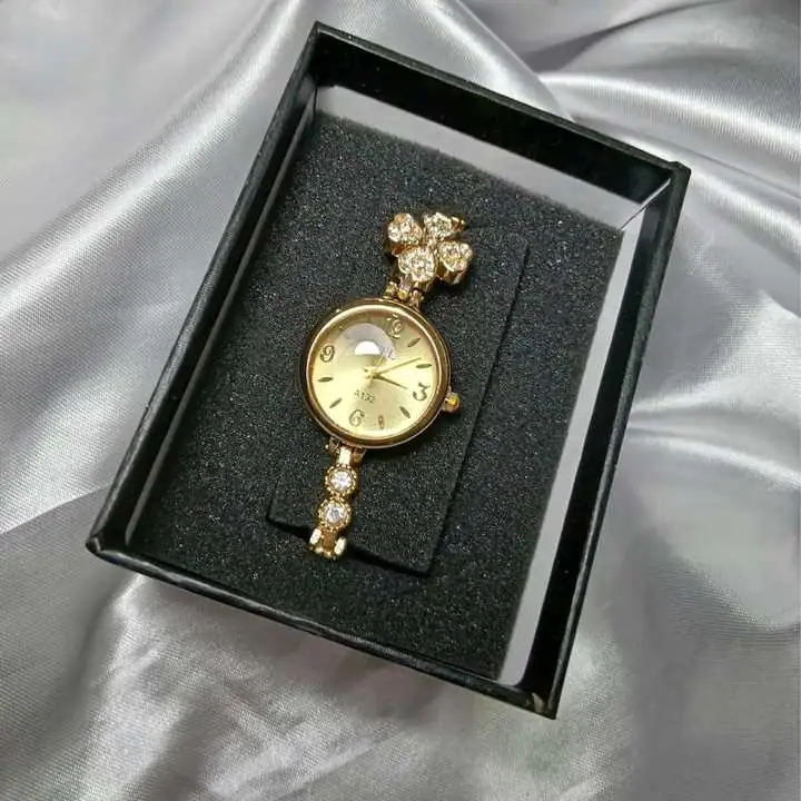 Reloj acero dorado Trébol