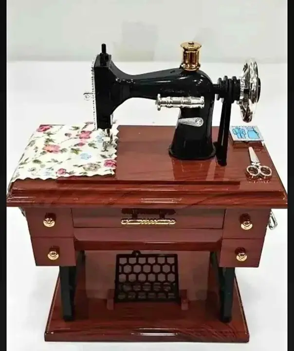 Maquina de coser(CAJITA MUSICAL)