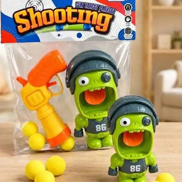 Pistola lanza bolas con muñeco
