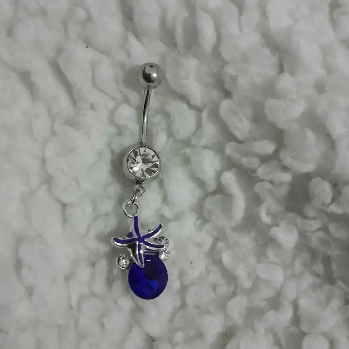 Piercing ombligo estrella de mar azul