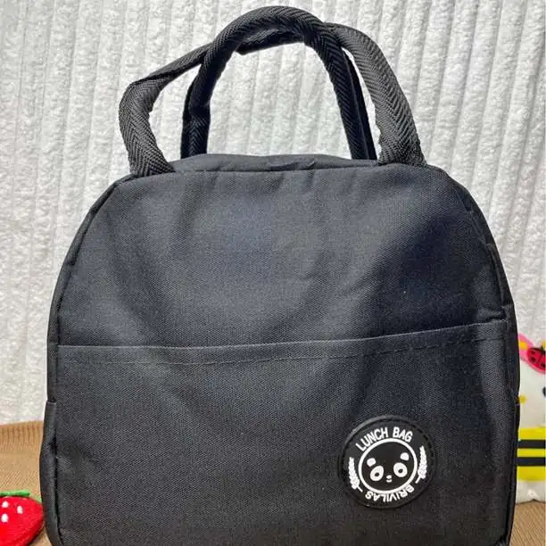 Lunchera térmica con bolsillo 21.5cm aprox. de alto x 21cm de ancho x 11.5 de prof