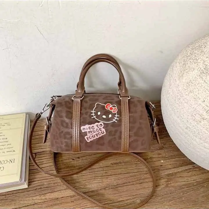 Cartera pequeña hello Kitty animal print