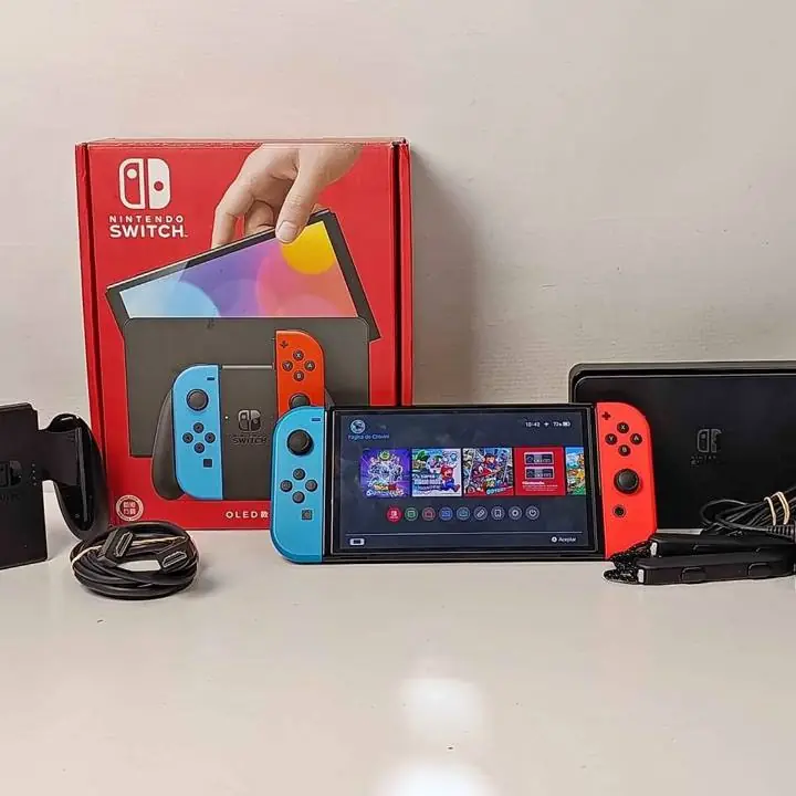 Nintendo switch oled roja y negra en caja c/cargador y acc completos con magia