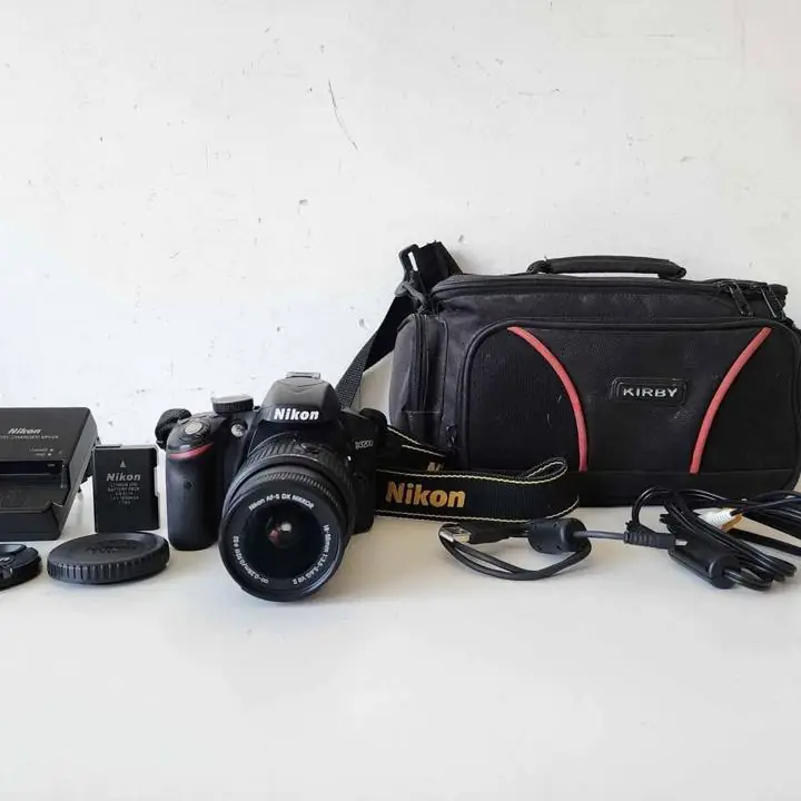 Camara D5100 mas kit 18-55MM + caja + bolso + cargador y bateria y memoria