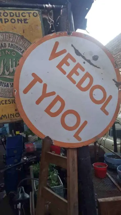 Cartel enlozado veedol tydol doble faz