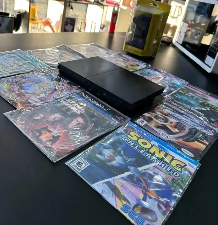 PlayStation 2 + 1 jóystick + 10 juegos