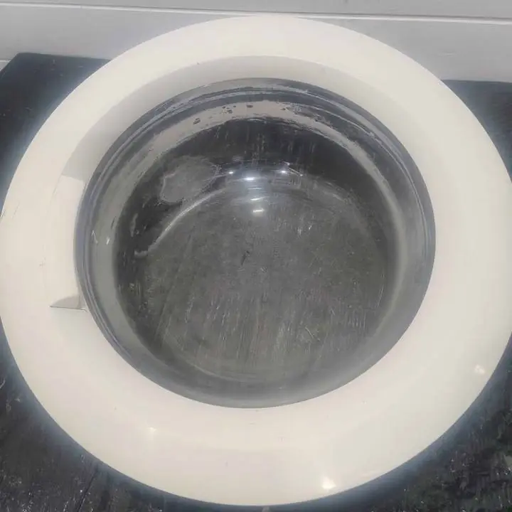 Puerta con visor de vidrio de lavarropas aurora