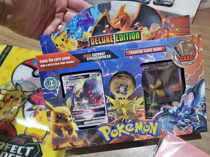 Boster nuevo cartas pokemon y medalla