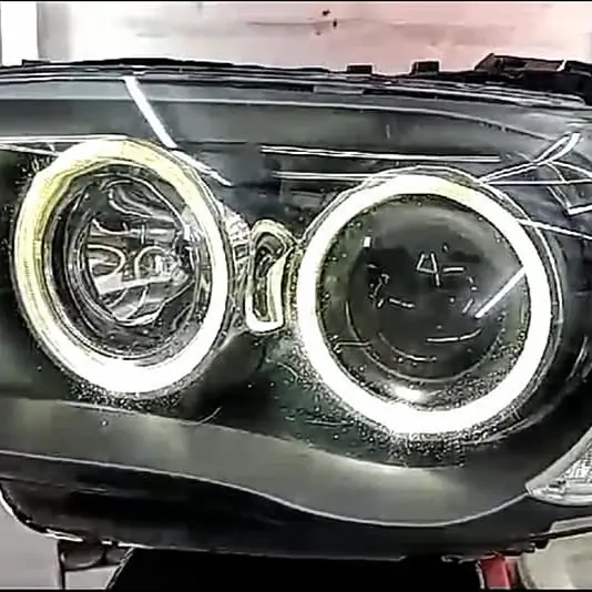 Óptica izquierda BMW serie 1 2010 con lupa y ojo de angel